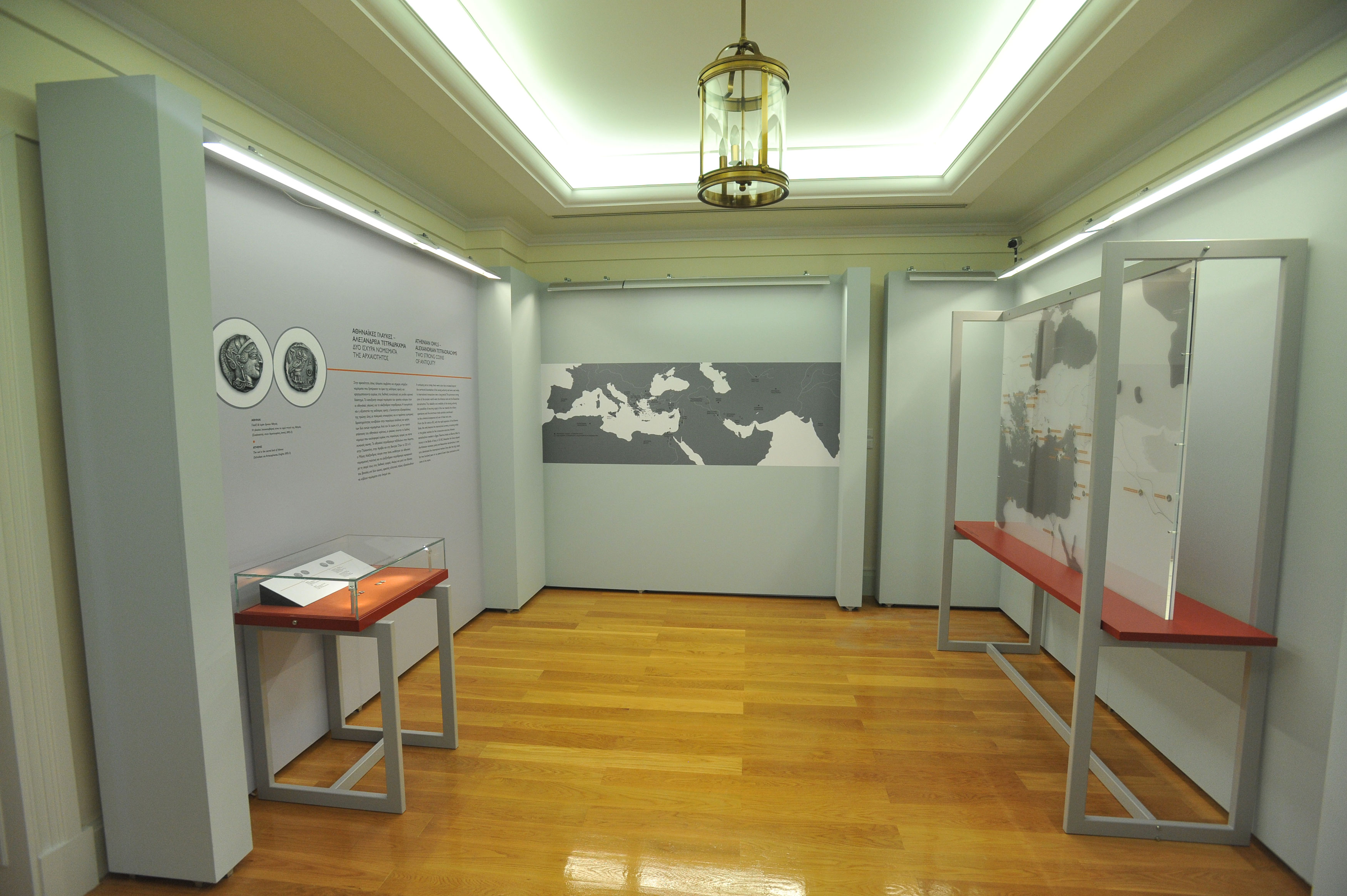 The exhibition area with exhibits in illuminated cases and relevant useful material.  Exhibits “Coins in the Ancient Greek World”