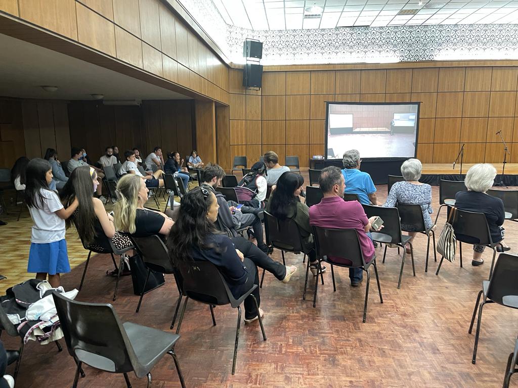 Audience seated watching a video presentation.   The Museum Cases in Pretoria at South Africa