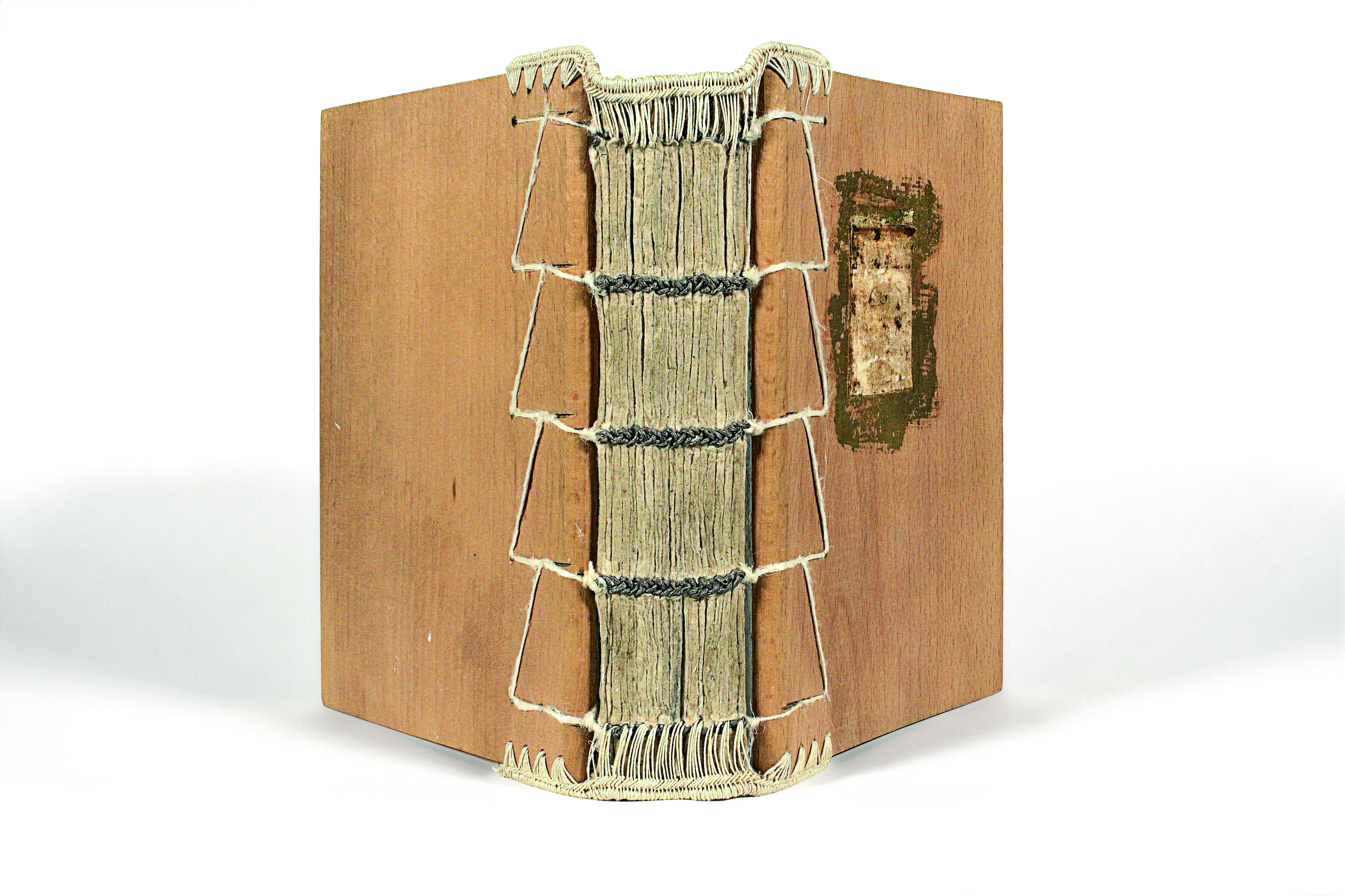 Book cover made of handmade paper and sheets of gold with a spine of jute and stitches at the edges. Bookbinding piece