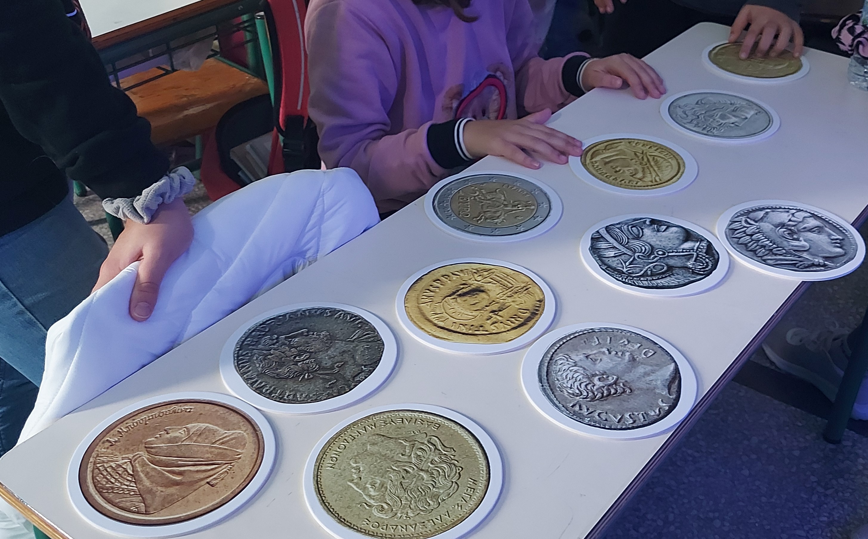 Enlarged paper coin replicas