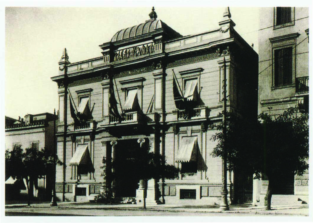 Popular Bank’s headquarters façade on Panepistimiou Street with a domed roof, window awnings and columns at entrance.  Privately-owned headquarters on Panepistimiou Street