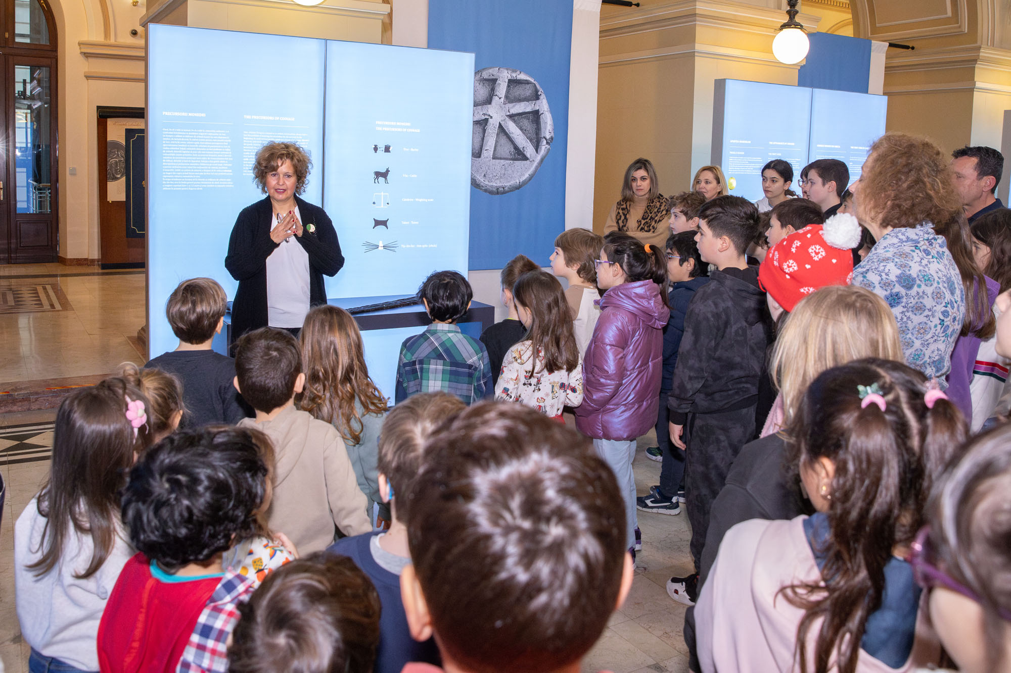 Ms Dimitra Tsangari giving students a tour of the exhibition at the Museum of the National Bank of Romania. Highlight from the guided tour
