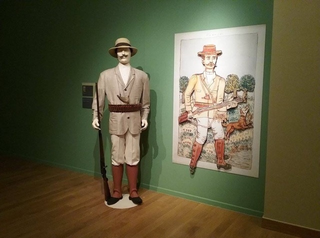 A painting by Theophilos and a 3D figure of a man with a rifle.  A painting by Theophilos and a 3D figure of a hero from the Greek Revolution of 1821.