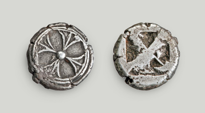 The obverse depicts a wheel. An incuse square on the reverse.  Silver drachma, Athens, 550-530 BCE