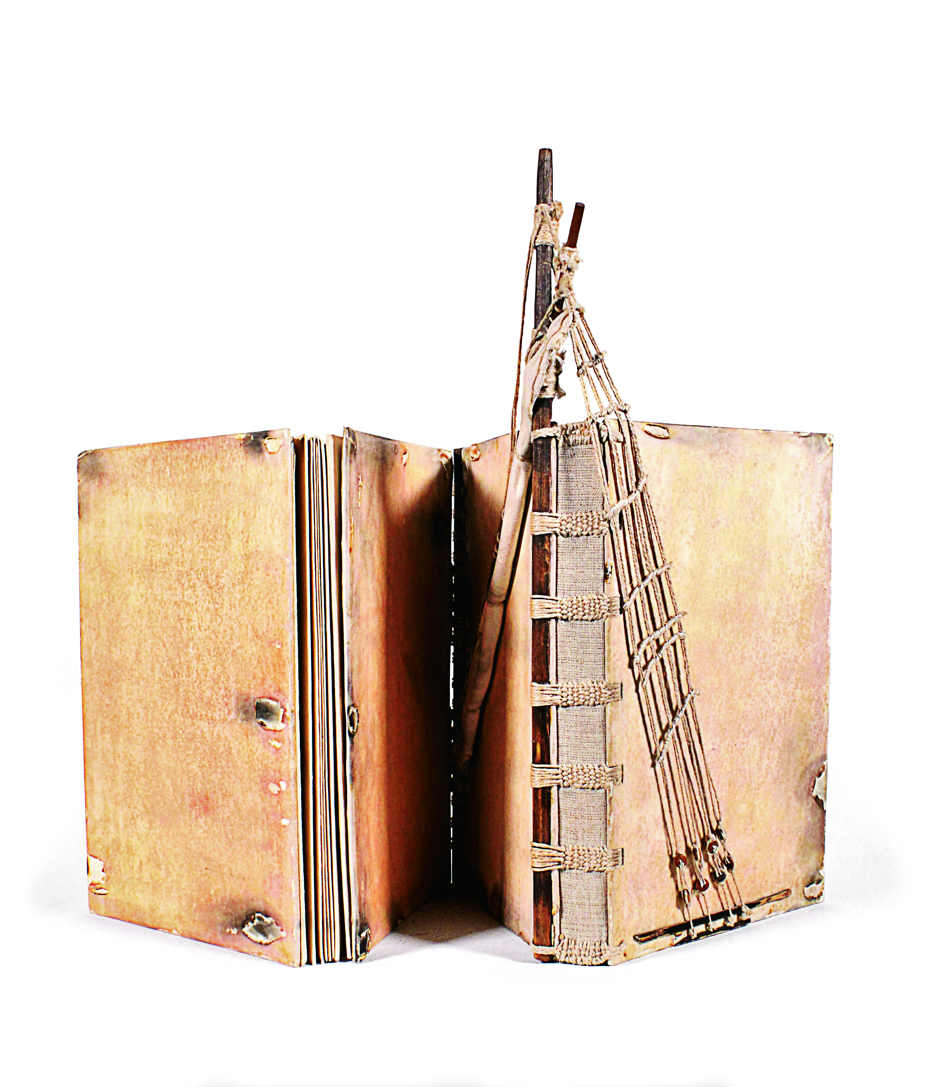 Book covers with knotted wood design. On one of them, branches and ropes make up a boat mast.  Bookbinding piece