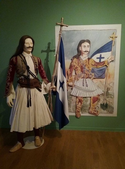 A painting by Theophilos and a 3D figure of a hero from the Greek Revolution of 1821.    Exhibits from the exhibition “Theophilos the painter”