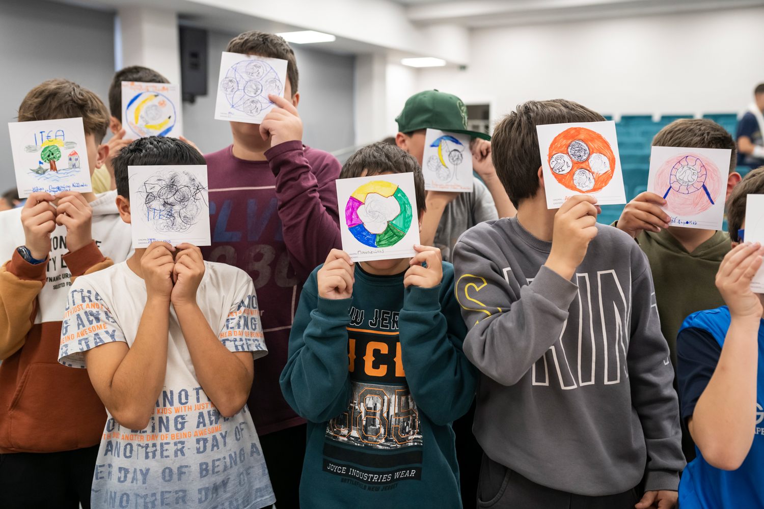 Students showing off their designs and paintings. Workshop at the Kyriakopouleio Cultural Centre in Itea